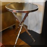 F13. Pair of Pair of metal and granite side tables. 22”h x 17”w 